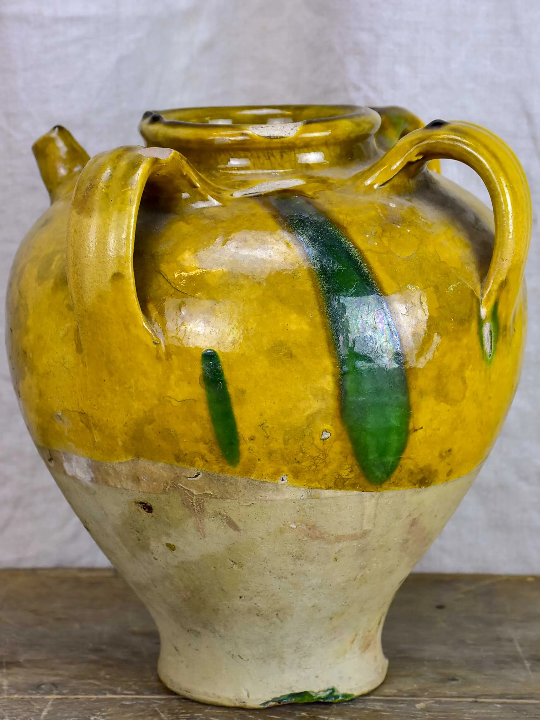 Antique French water jug with yellow and green glaze