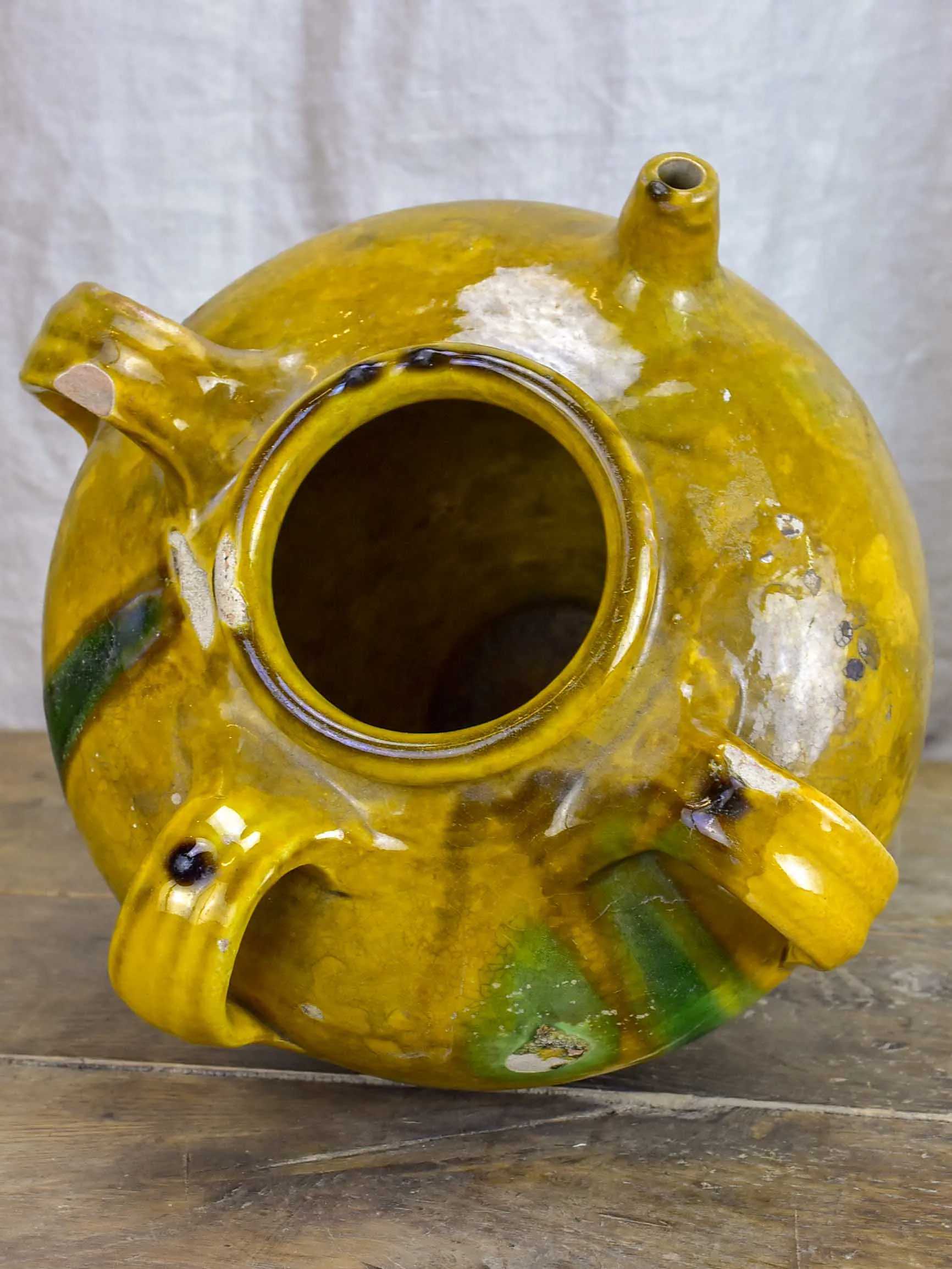 Antique French water jug with yellow and green glaze