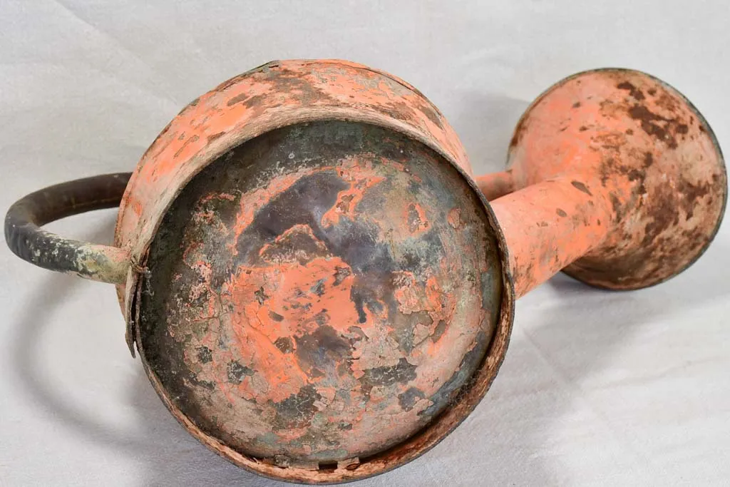 Nineteenth-century French watering can with orange patina